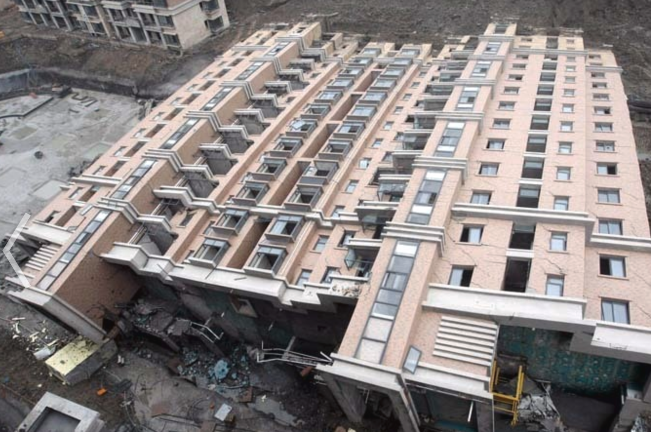 On June 27, 2009, a 13-story apartment complex in Shanghai, China toppled over onto the ground. One worker, who had run back inside the building to grab his tools, was killed in the incident.   While it’s unclear what, exactly, caused the collapse, “Initial investigations attribute the accident to the excavations for the construction of a garage under the collapsed building,” The Wall Street Journal wrote of the incident, referencing local news outlet, Shanghai Daily. “Large quantities of earth were removed and dumped in a landfill next to a nearby creek; the weight of the earth caused the river bank to collapse, which, in turn, allowed water to seep into the ground, creating a muddy foundation for the building that toppled."
